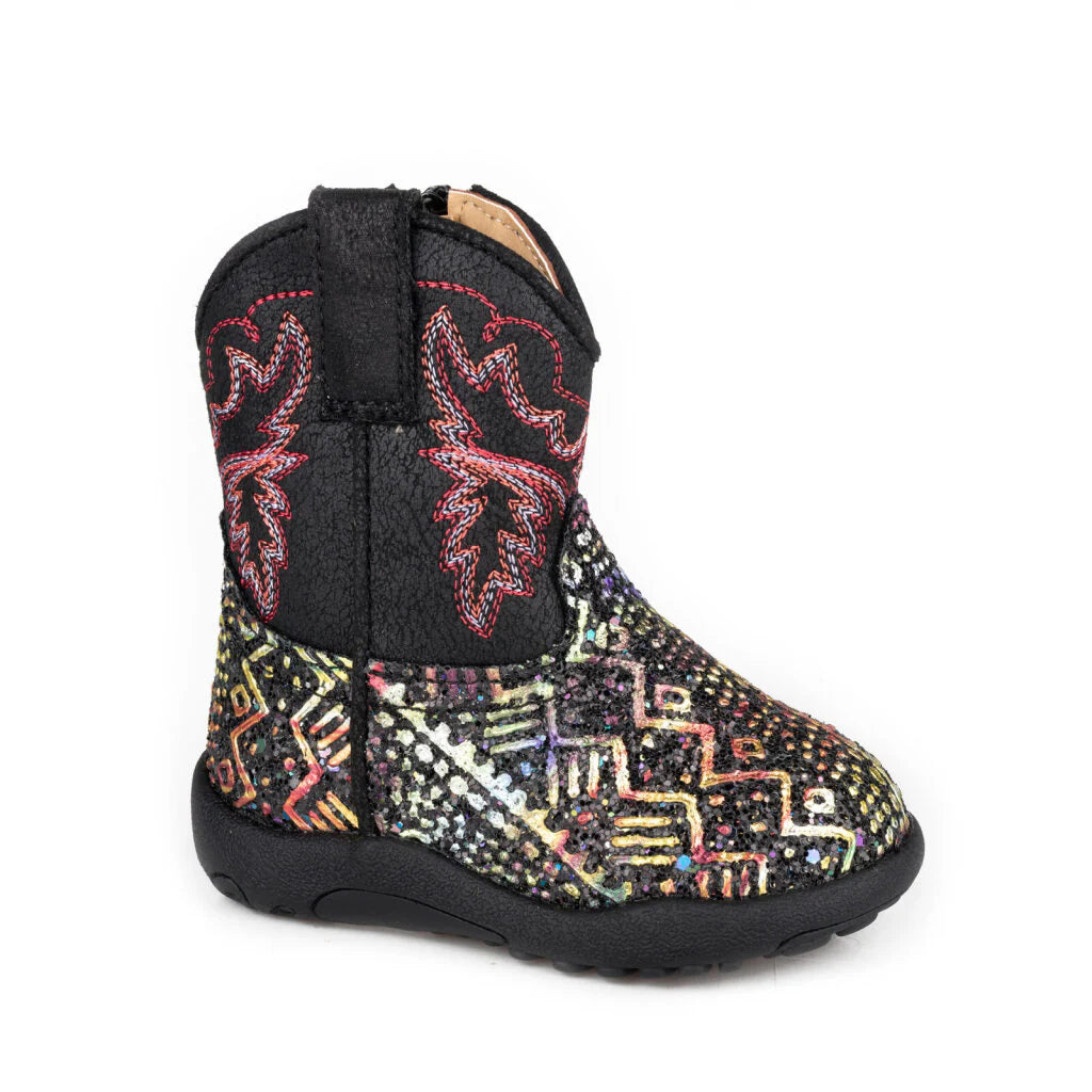 Multicolored patterned boot with black sole on a white background
