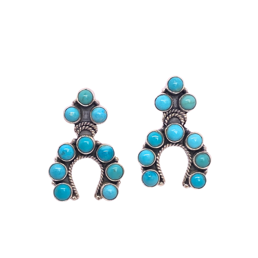 Wild Brumby Co Wild Heart Protector Earrings. Horseshoe-shaped earrings with turquoise stones on a white background