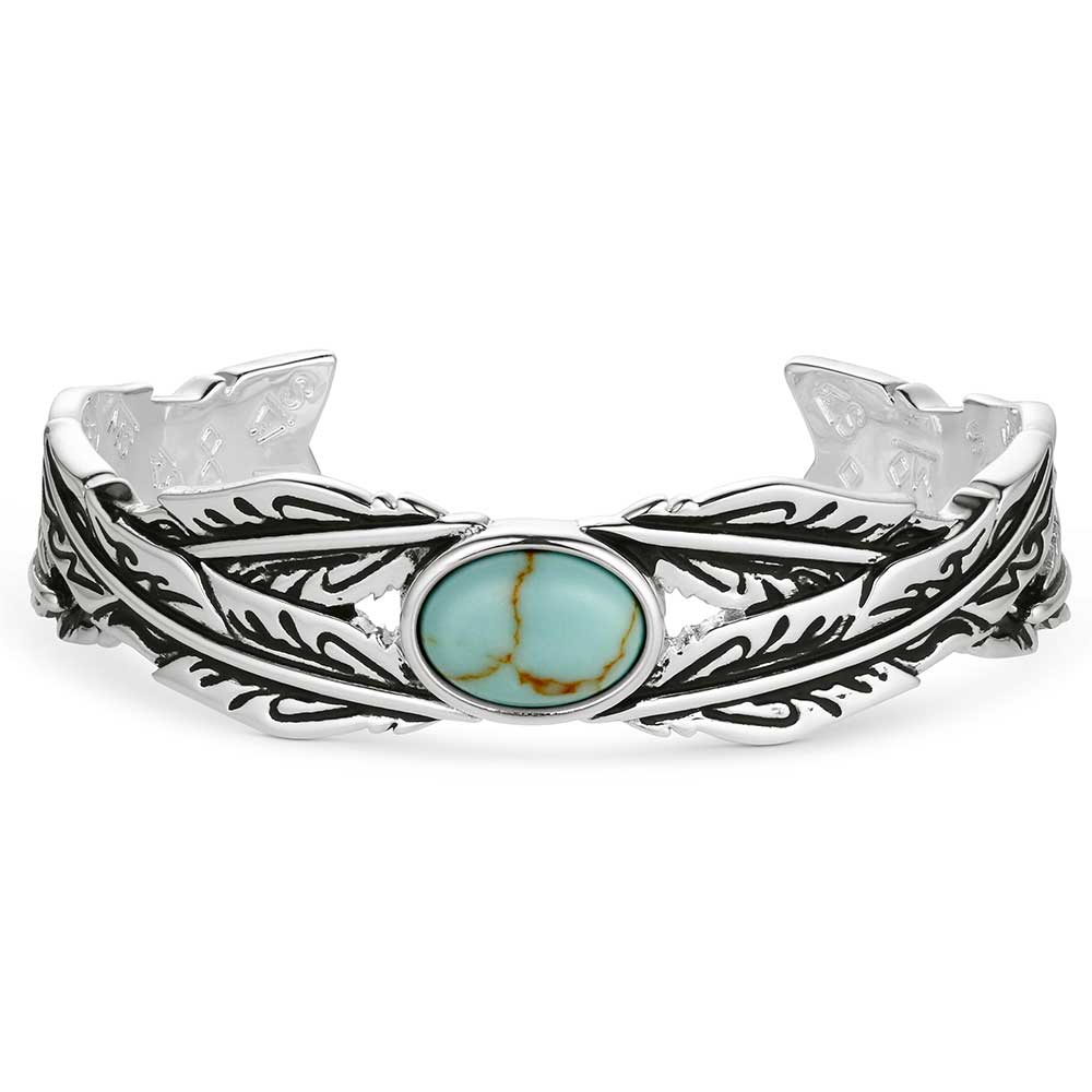 Silver bracelet with turquoise stone on a white background