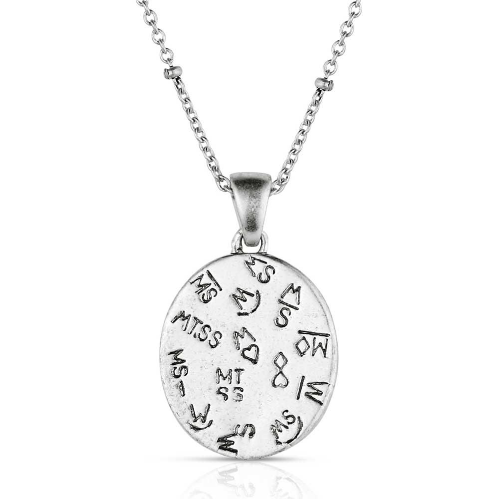 Silver necklace with a pendant featuring a white stone on a white background