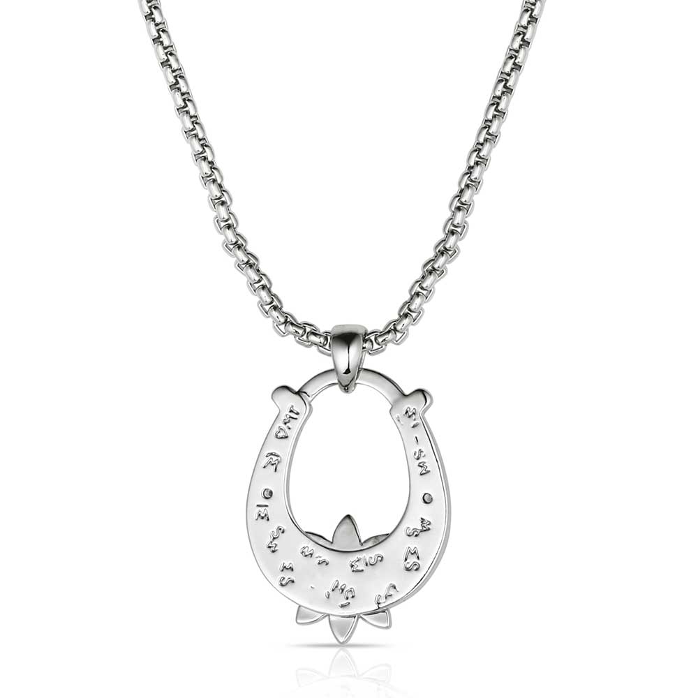 Necklace with a horseshoe pendant featuring turquoise stones on a white background