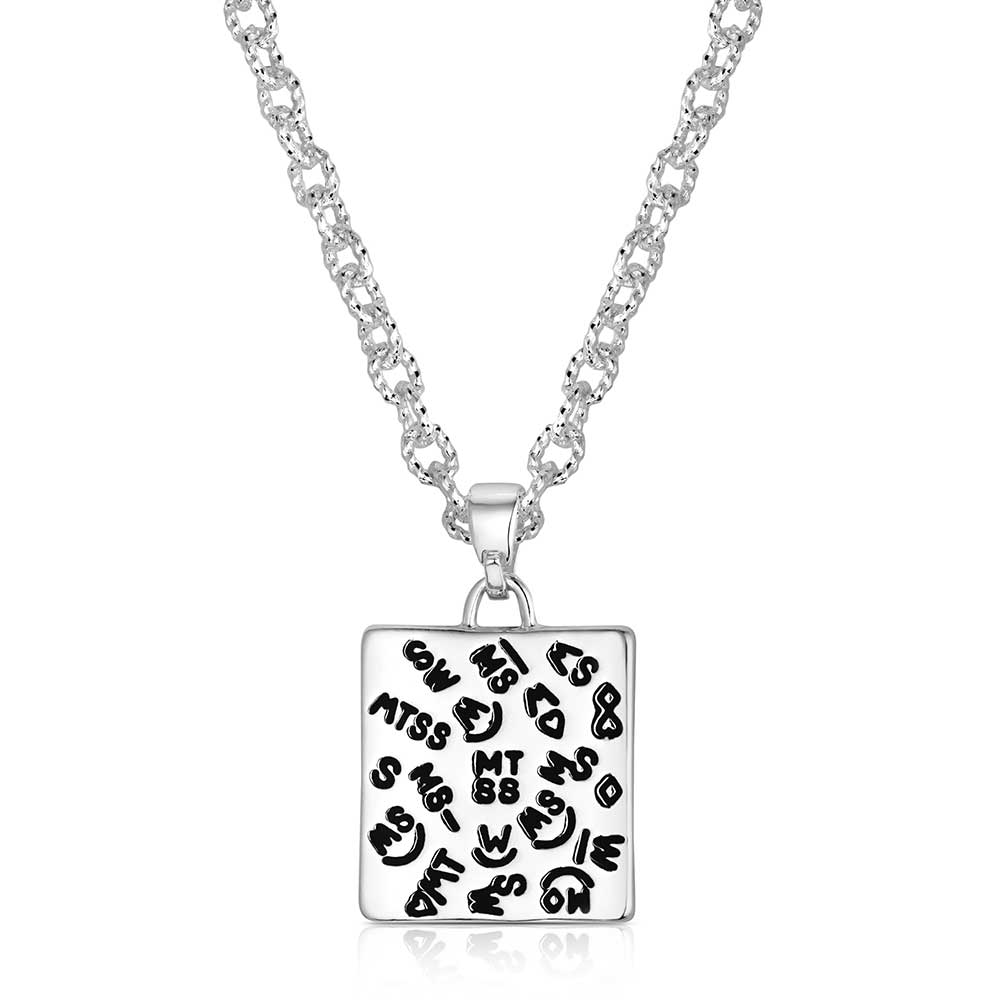 Silver necklace with a square pendant featuring black text and smiley faces on a white background