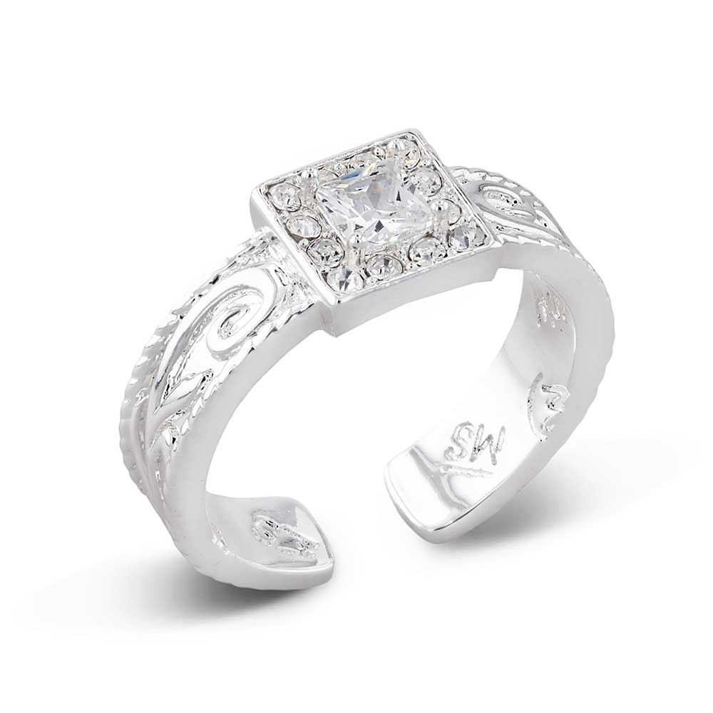 Silver ring with a large diamond and intricate design on a white background