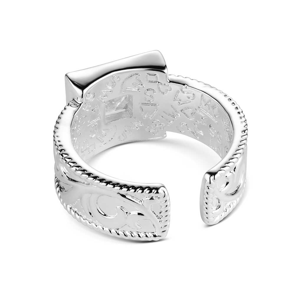 Silver ring with intricate designs on a white background