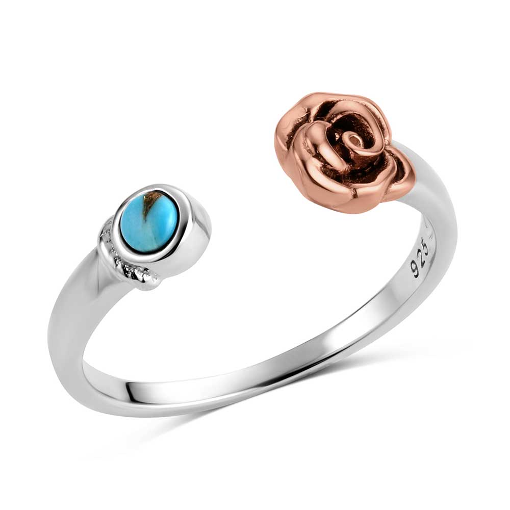 Silver ring with rose design and turquoise stone on a white background