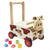 I'm Toy Walk And Ride Cow Sorter. Wooden toy cow push cart with colorful blocks on a white background