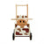 I'm Toy Walk And Ride Cow Sorter. Wooden toy cow with wheels and a handle on a white background