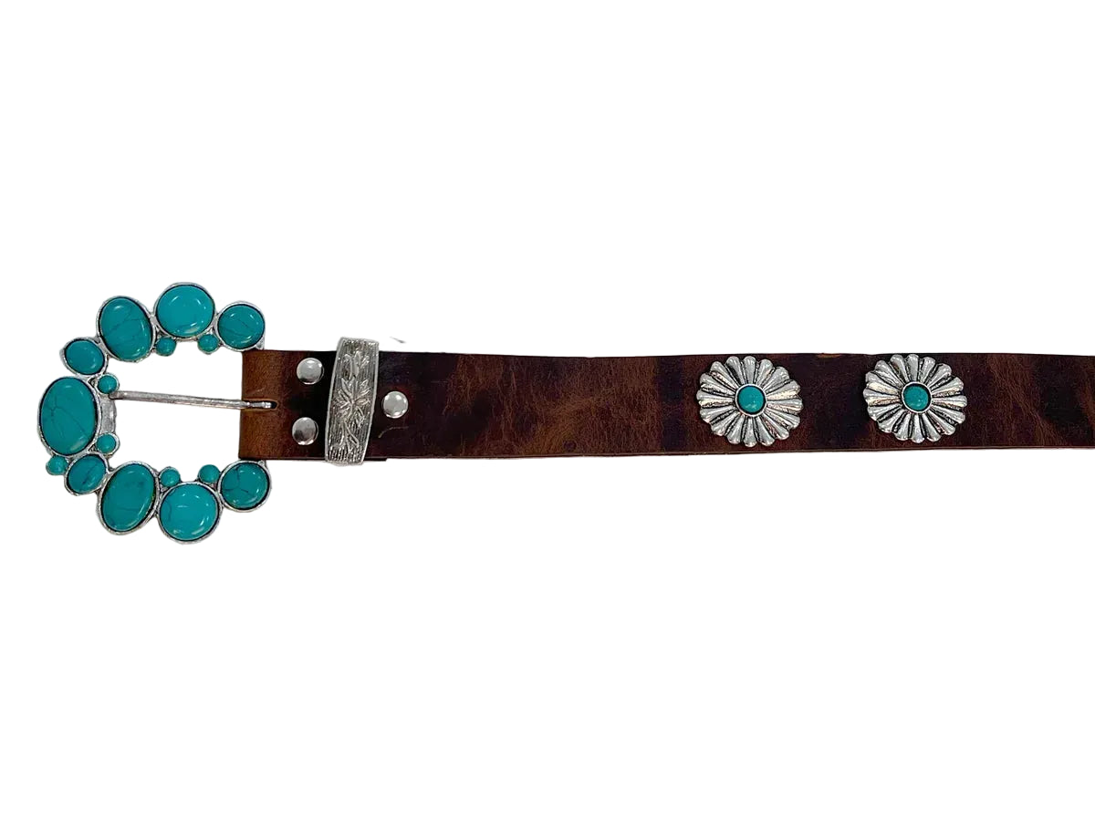 A brown leather belt with a dark brown tooled pattern, featuring silver conchos with turquoise centers and a large matching turquoise and silver buckle.