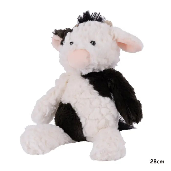 Plush cow toy with black and white pattern on a white background