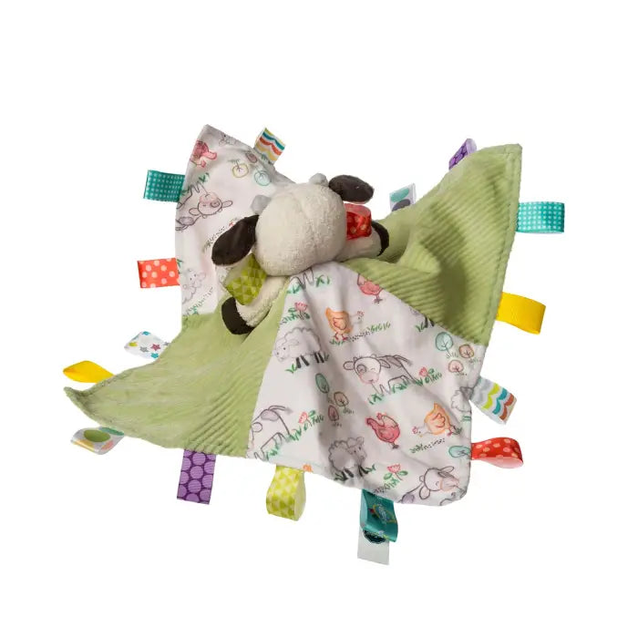 A sheep-shaped sensory lovey security blanket with a white fabric body featuring colorful cartoon animal prints, a light green ribbed fabric wing, a plush sheep head, and colorful fabric tabs.
