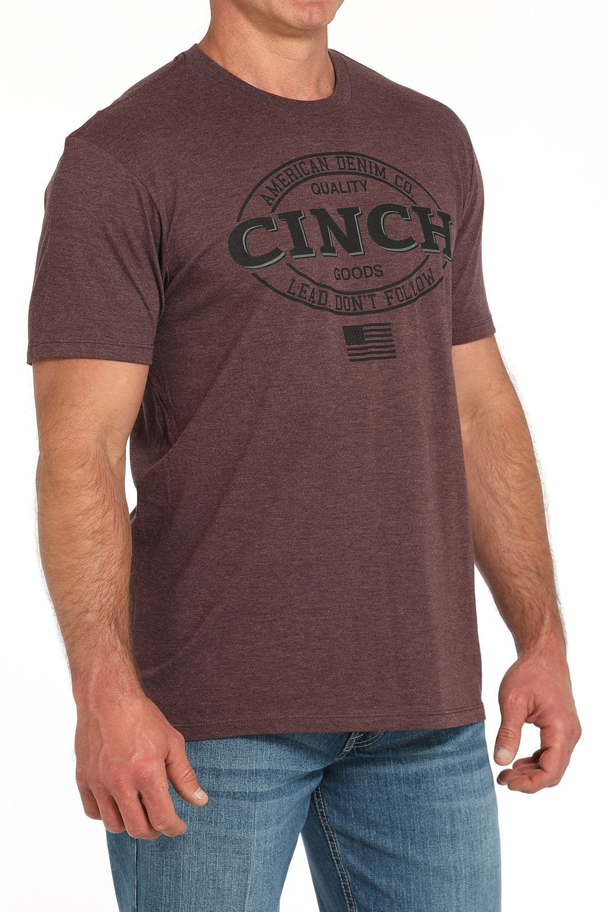 Cinch Lead Don't Follow Men's T-Shirt. Man wearing a brown t-shirt with 'Cinch' logo on a white background
