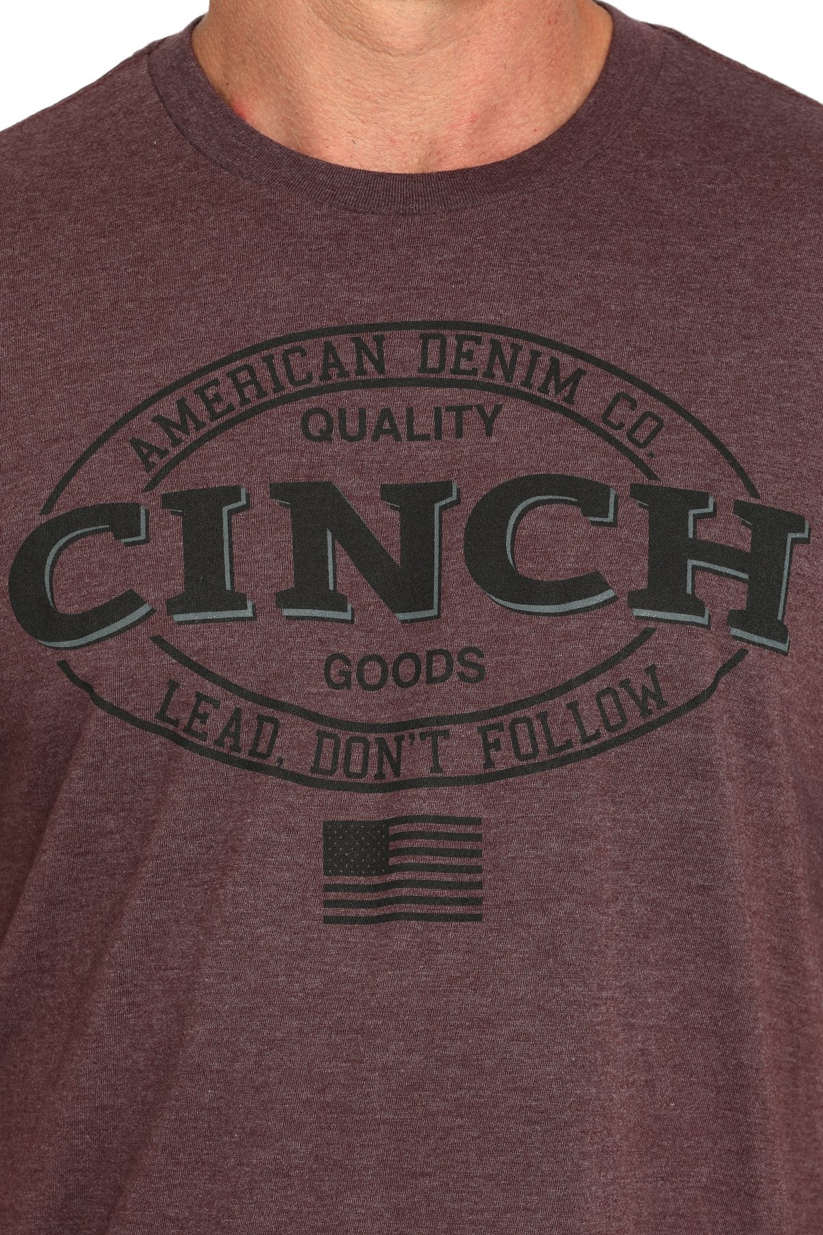 Cinch Lead Don't Follow Men's T-Shirt. Maroon t-shirt with 'Cinch' logo and text on a plain background