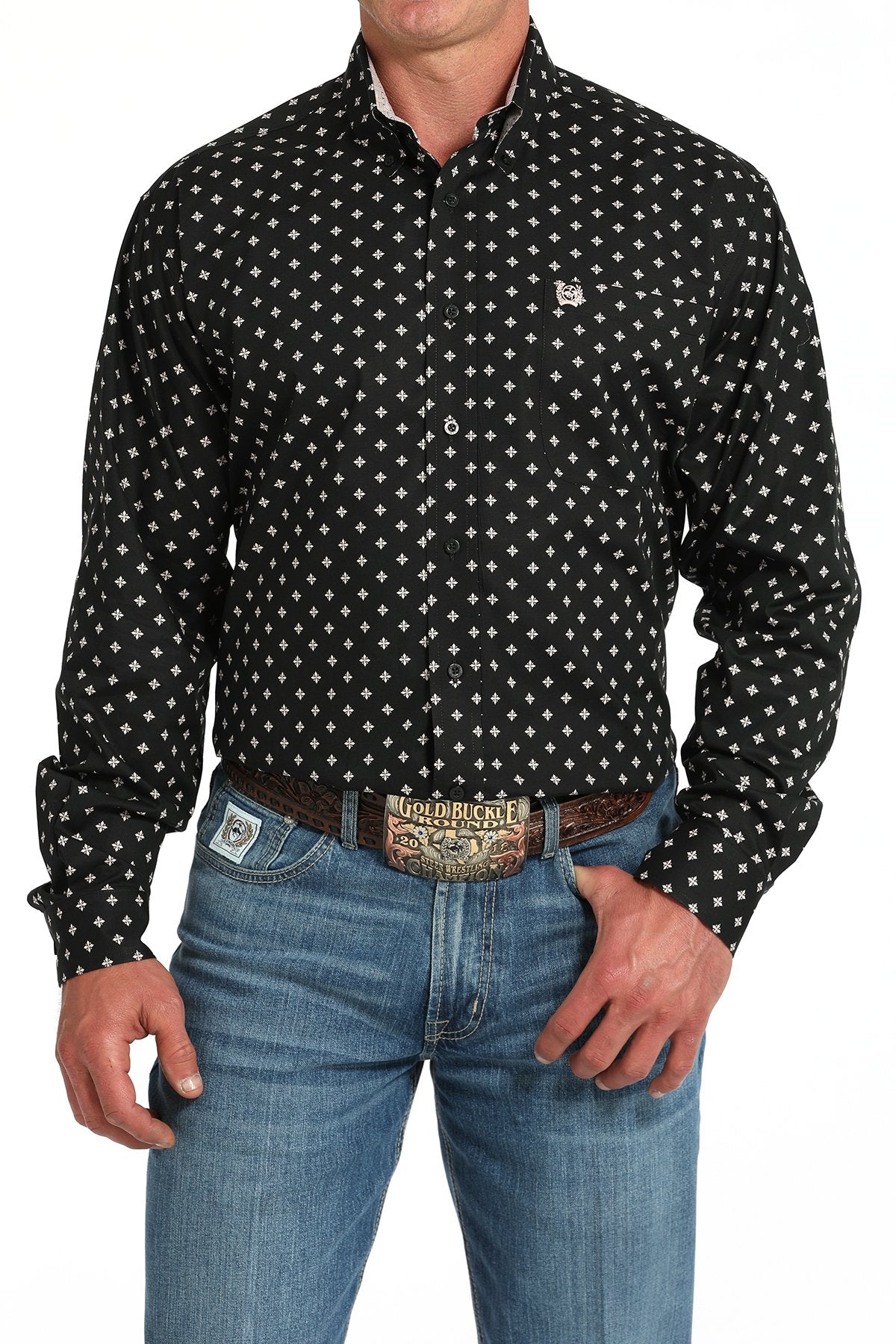 Cinch Men's Geometric Print L/S Western Shirt. Man wearing a black patterned shirt and blue jeans on a white background