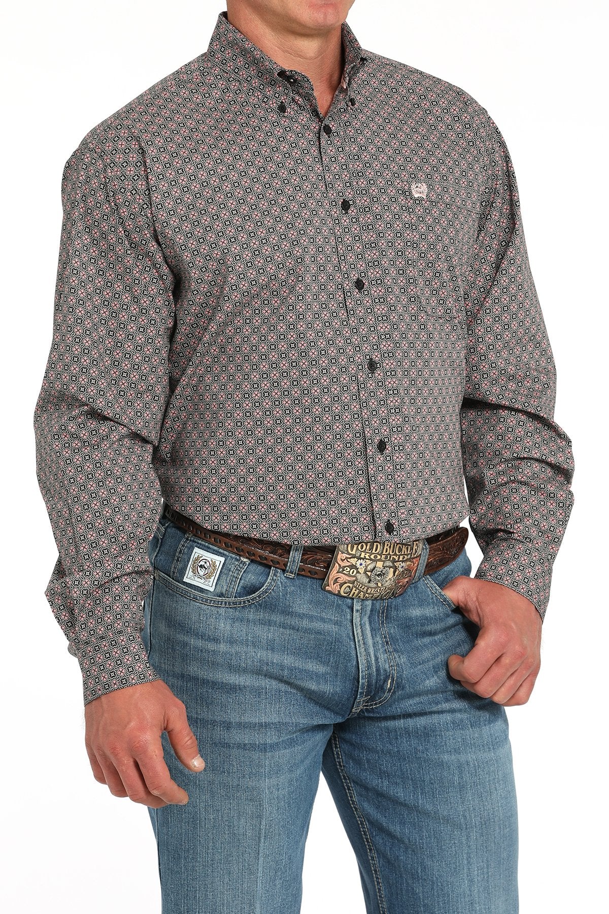 Cinch Men'sMedallion Print L/S Western Shirt. Man wearing a patterned button-up shirt and jeans on a white background