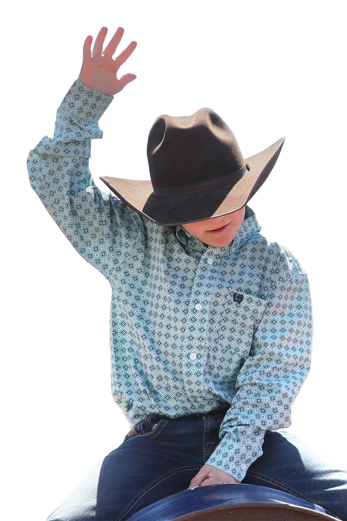 Cinch Boy's Geometric Print L/S Western Shirt. Person wearing a patterned shirt and cowboy hat outdoors with a clear sky.