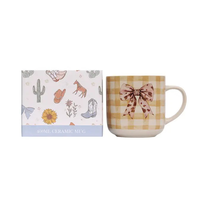 A 400ml ceramic mug with a yellow and white gingham pattern, featuring a brown bow design on the front, shown next to its illustrated packaging box on a white background.