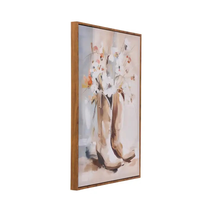 A framed vertical canvas print featuring a watercolor-style painting of white orchids in a vase with beige and brown boots, shown at an angle against a plain white background.
