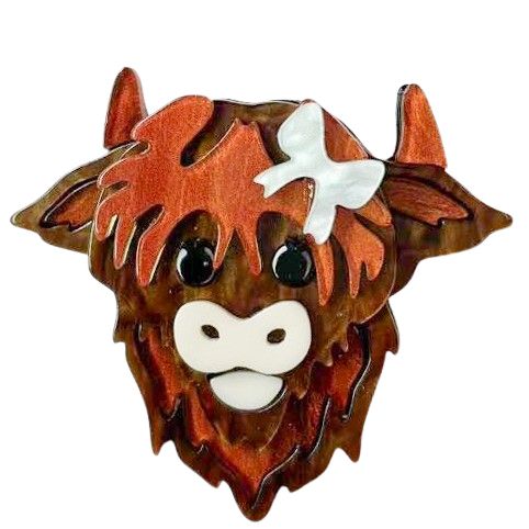 Wooden highland cow head with a white flower on a white background