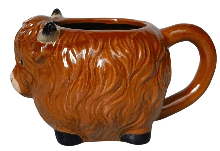 Ceramic mug shaped like a brown bear on a white background