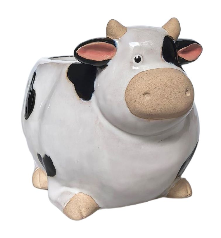 A ceramic cow-shaped piggy bank with a glossy white body, black spots, pink inner ears, and beige horns, legs, and snout, shown on a plain white background.