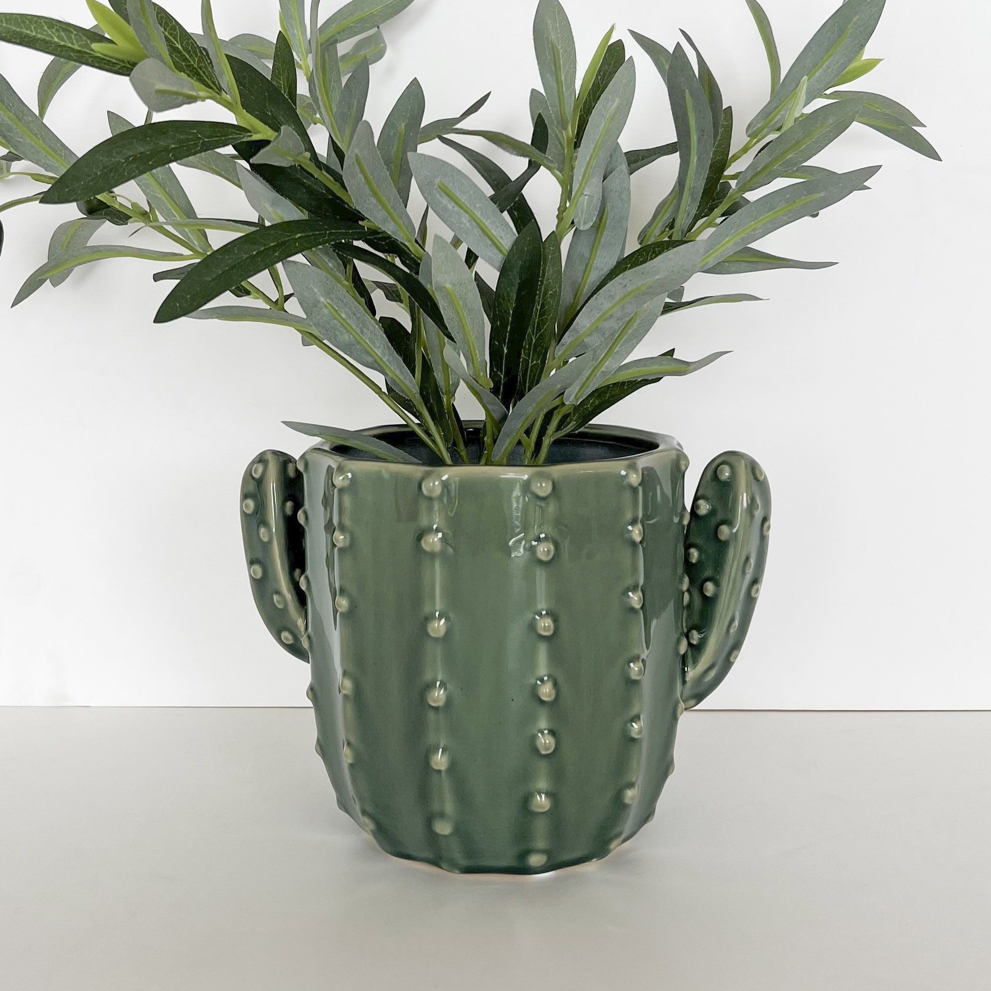 Urban Products 20cm Cactus Planter . Green ceramic cactus-shaped mug with bumpy texture on a white background