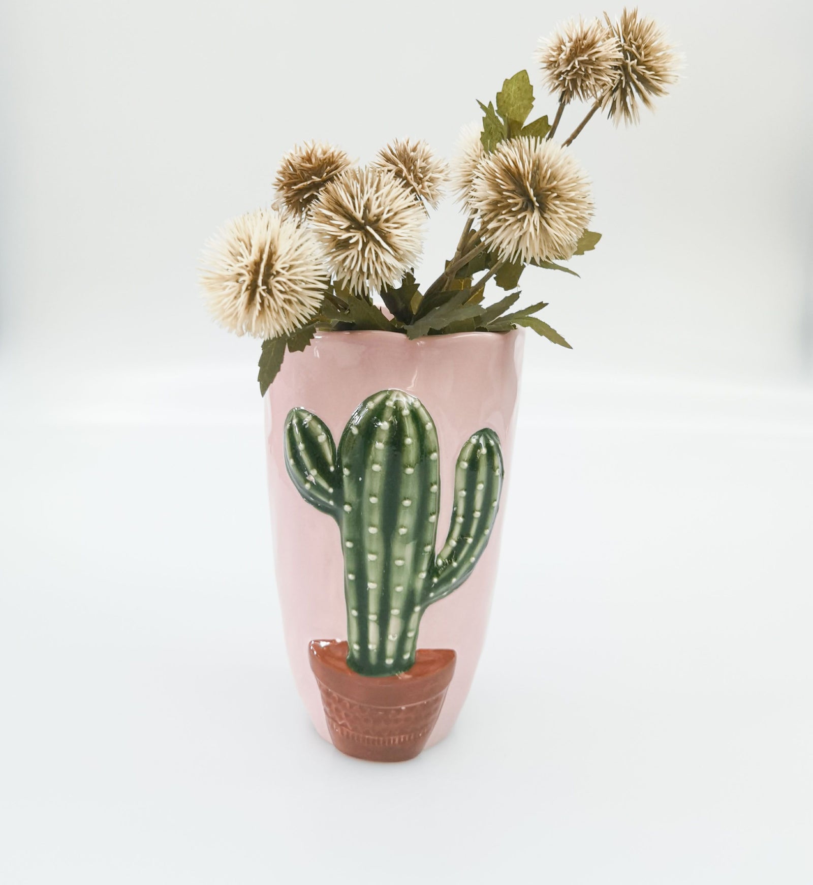 Urban Products 18cm Catus Vase. Ceramic tumbler with a green cactus design on a pink background