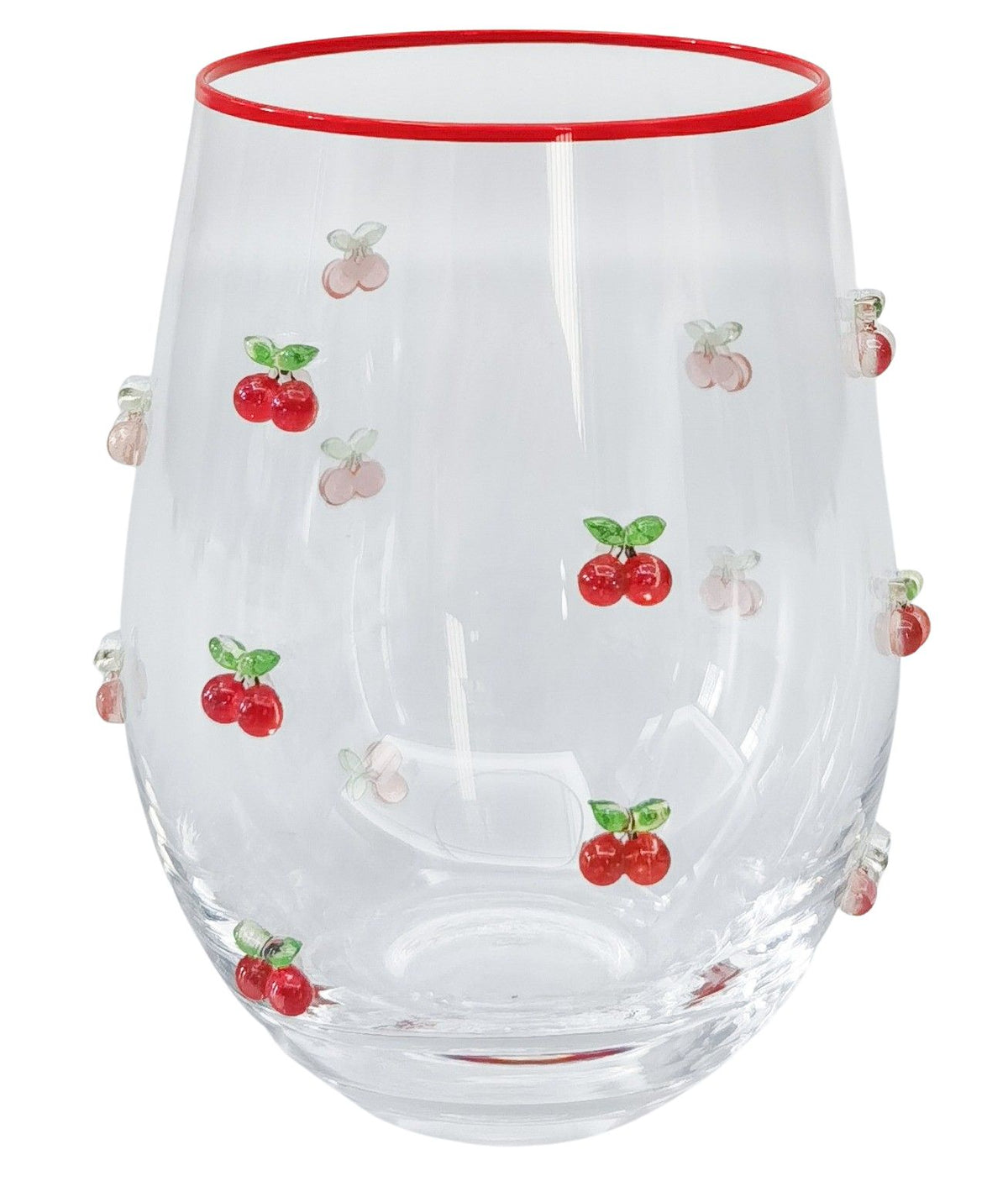 Urban Products 12cm Kaya Cherry Stemless Glass. Clear glass tumbler with red rim and cherry designs on a white background