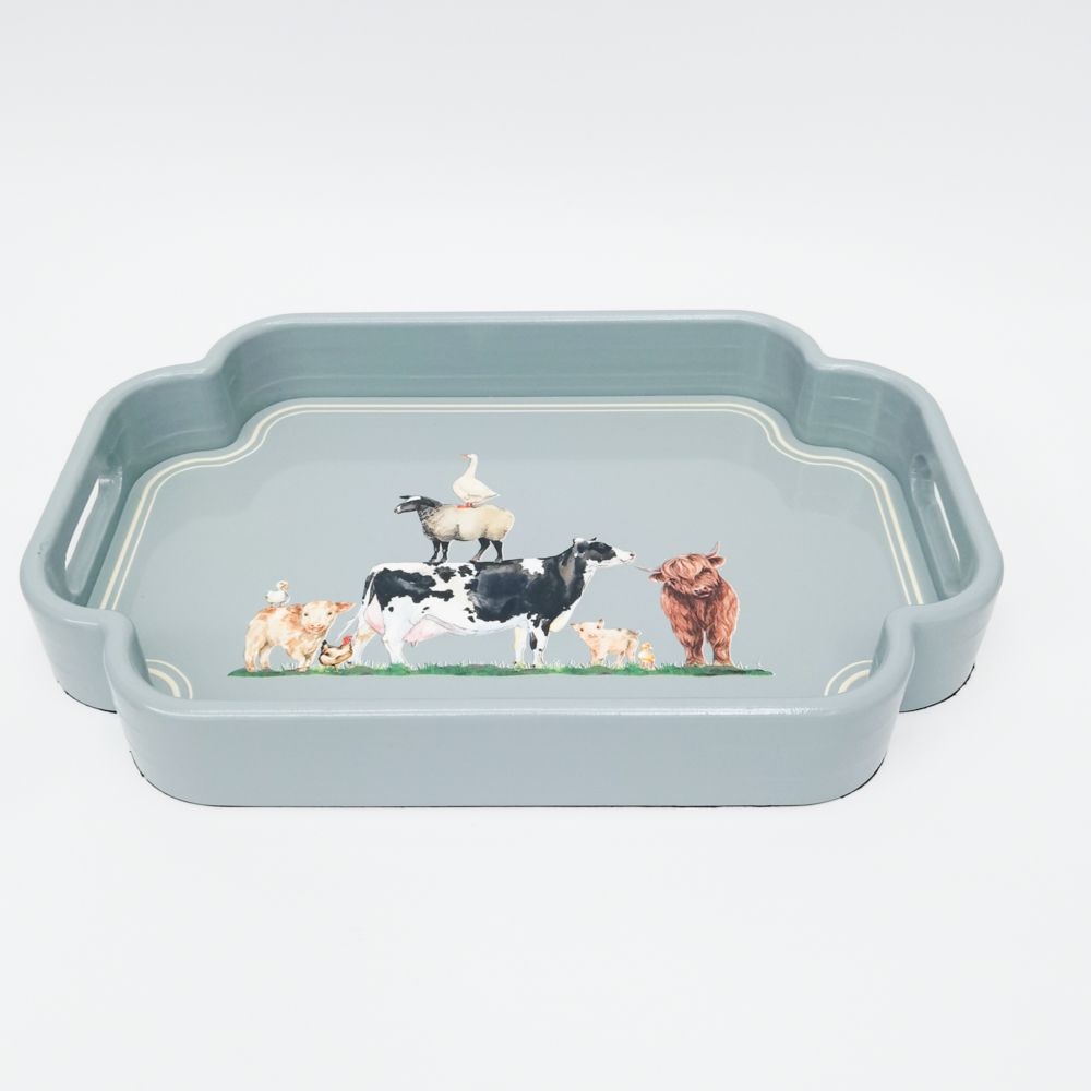 Rectangular tray with farm animal illustrations on a light blue background