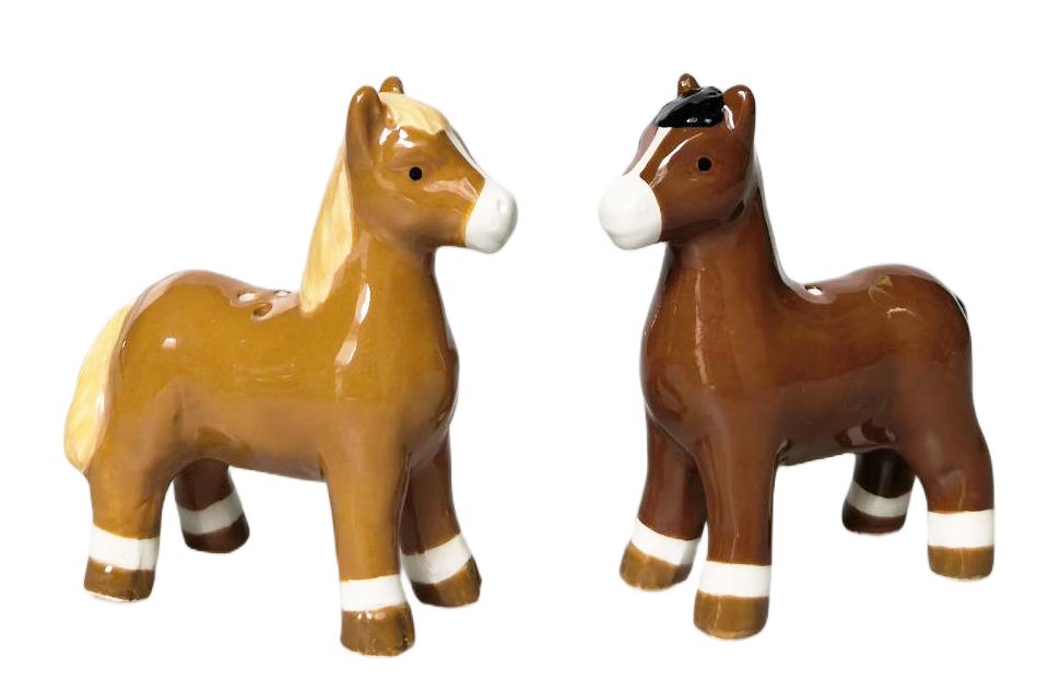 Two glossy ceramic horse figurines on a plain white background, one tan with cream details and one dark brown with white details.