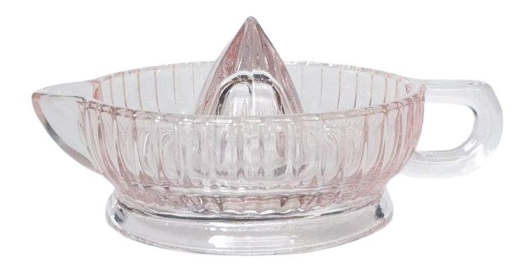 Clear glass lemon squeezer on a white background
