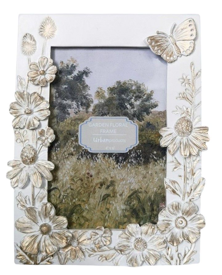 Decorative photo frame with floral and butterfly design on a white background