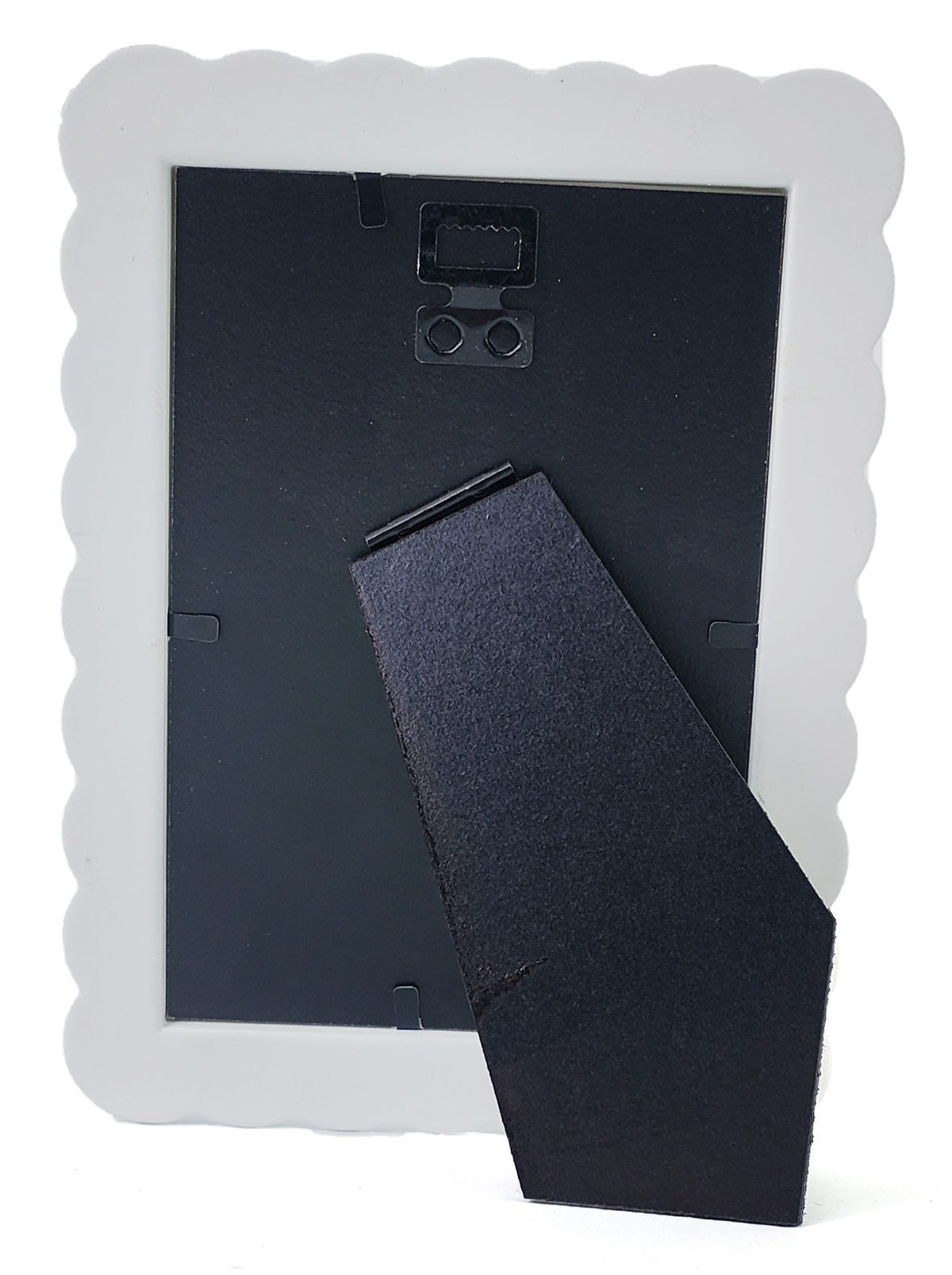 The back of a picture frame with a white scalloped border and a black hinged support stand, shown on a white background.