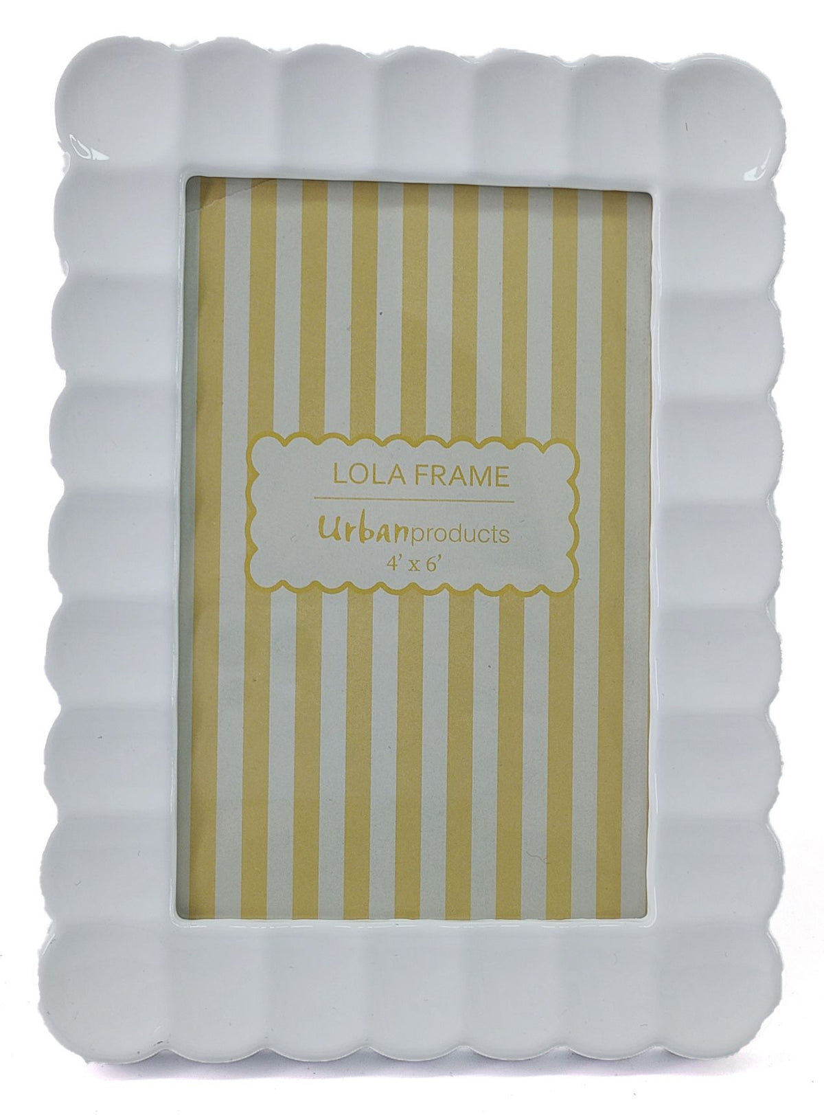 A white ceramic picture frame with a scalloped border, shown with a yellow and white striped insert card labeled 'LOLA FRAME Urbanproducts 4 x 6"'.