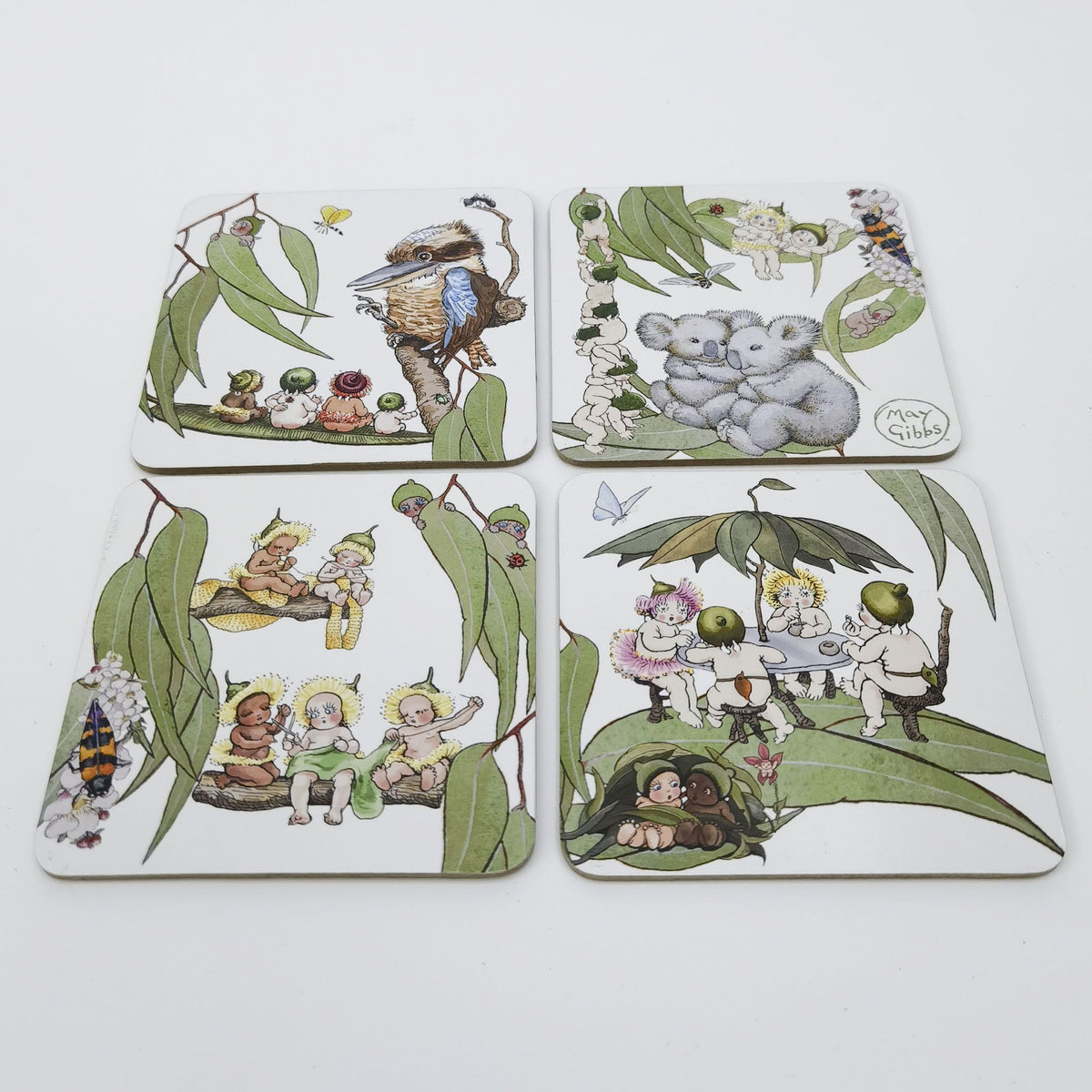 Urban Products May Gibbs Gumnut Baby Cork & MDF Coaster Set. Set of four coasters with illustrated designs on a white background