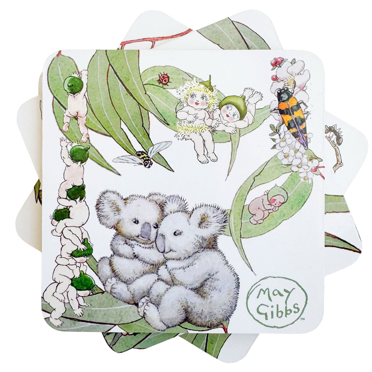 Urban Products May Gibbs Gumnut Baby Cork &amp; MDF Coaster Set. Illustrated coaster with koalas, fairies, and nature elements on a white background