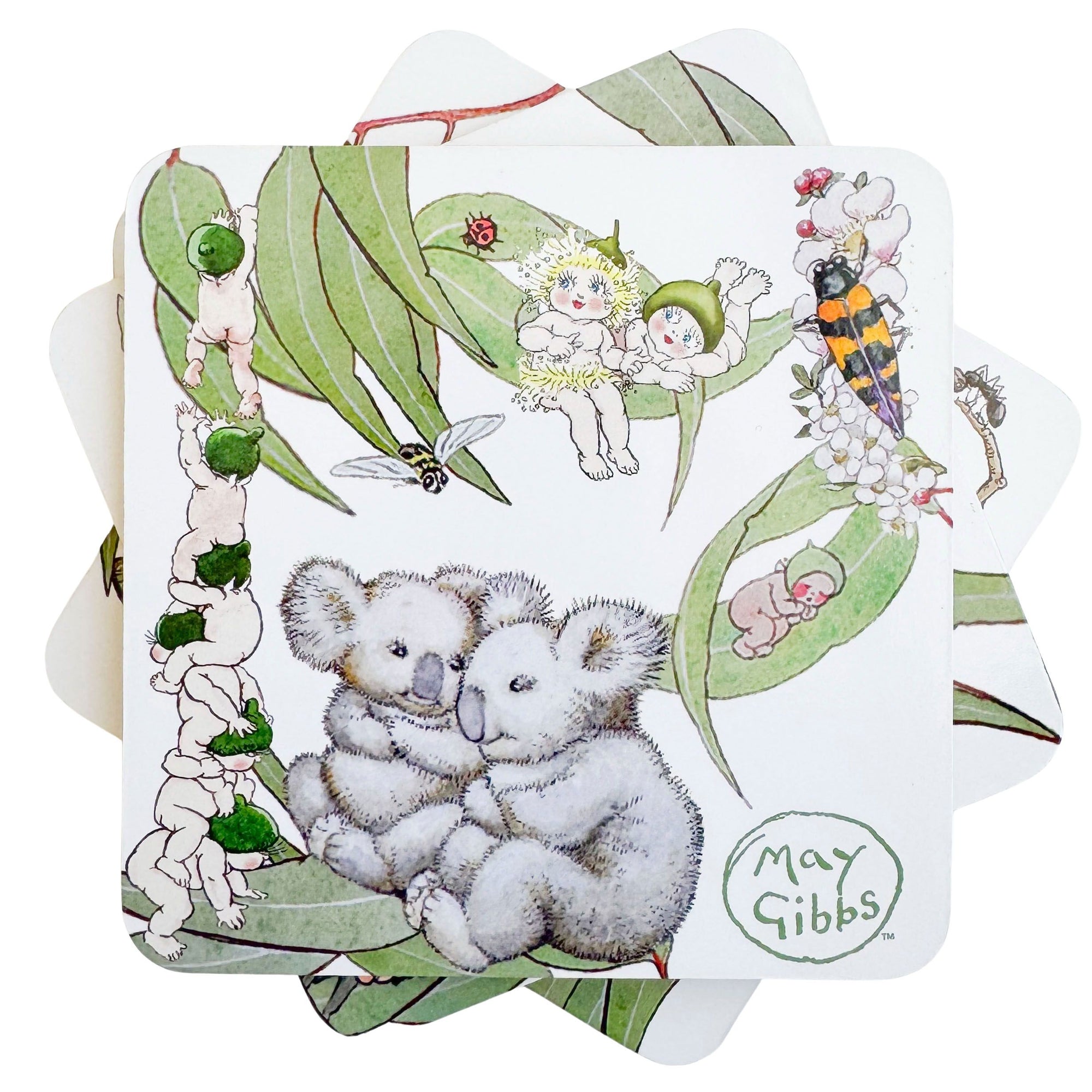 Urban Products May Gibbs Gumnut Baby Cork & MDF Coaster Set. Illustrated coaster with koalas, fairies, and nature elements on a white background